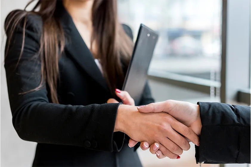 Specialist shaking hands with a client